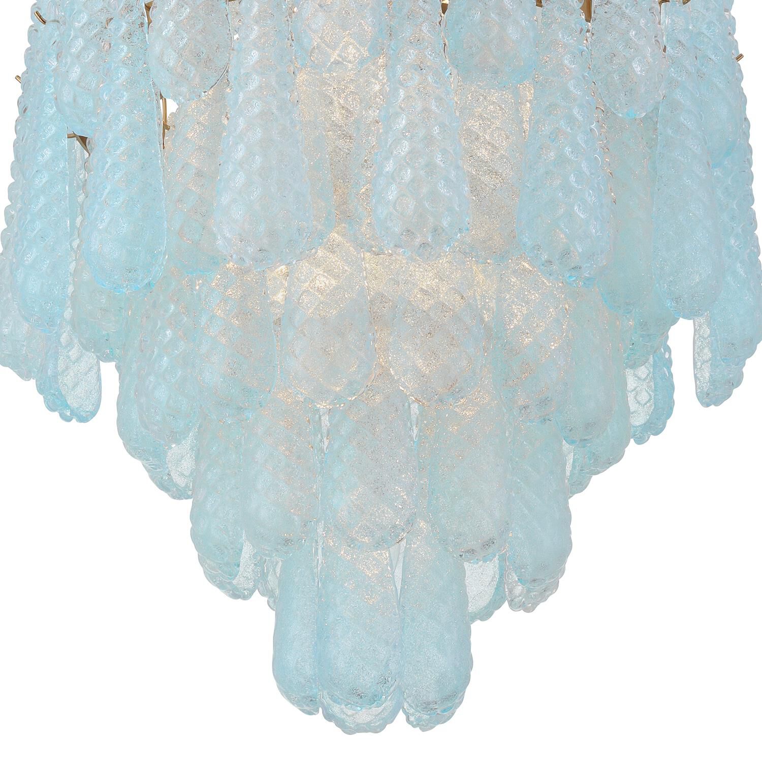 Shown in Aged Brass finish and Sand Blue glass